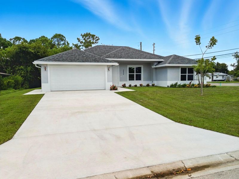 Front exterior of a new home in , Fort Pierce, FL, highlighting curb appeal (Image 2).