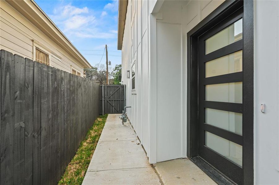 View of side of property featuring a gate View of side of property featuring a gate