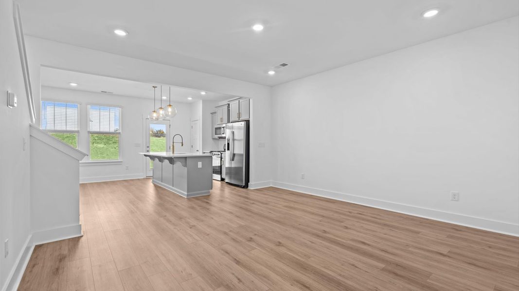 Exceptional family room with hardwood flooring in this exclusive Anderson-area townhome