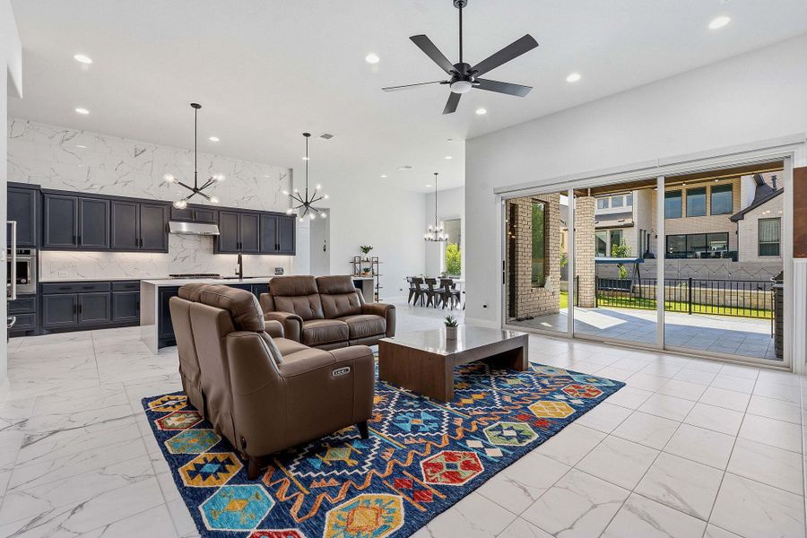 A spacious, open-concept living area with clean lines, smooth flooring, and an inviting outdoor connection. A spacious, open-concept living area with clean lines, smooth flooring, and an inviting outdoor connection.