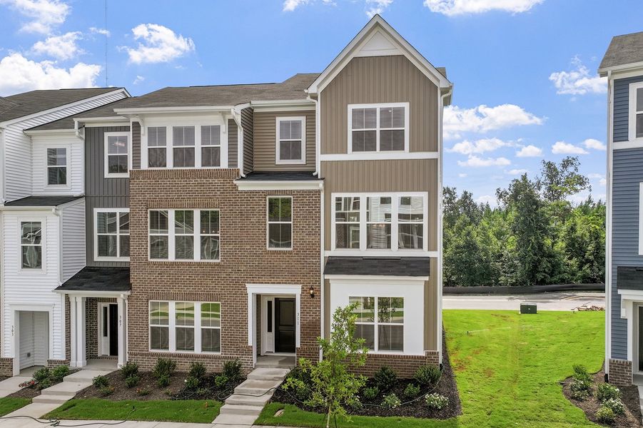 Front exterior of a new home in Renaissance at White Oak, Garner, NC, highlighting curb appeal (Image 2). Front exterior of a new home in Renaissance at White Oak, Garner, NC, highlighting curb appeal (Image 2).