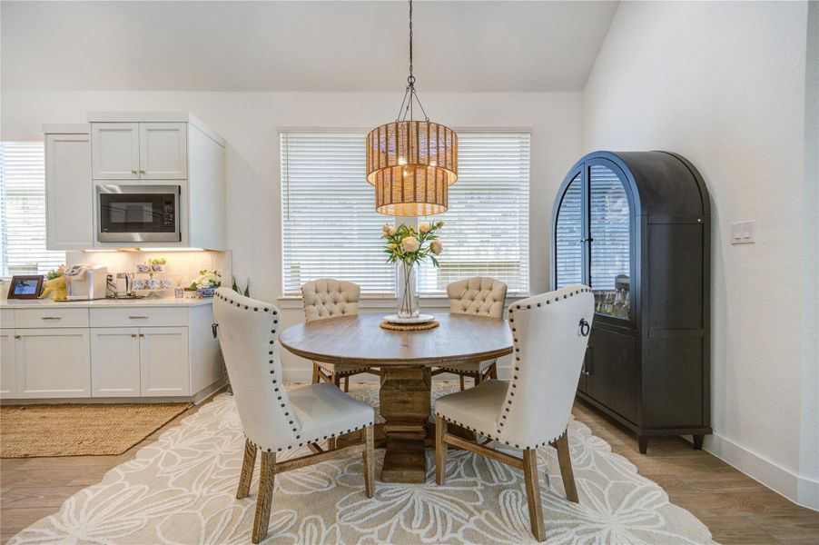 Large windows surround the dining area, bringing in natural light. Large windows surround the dining area, bringing in natural light.