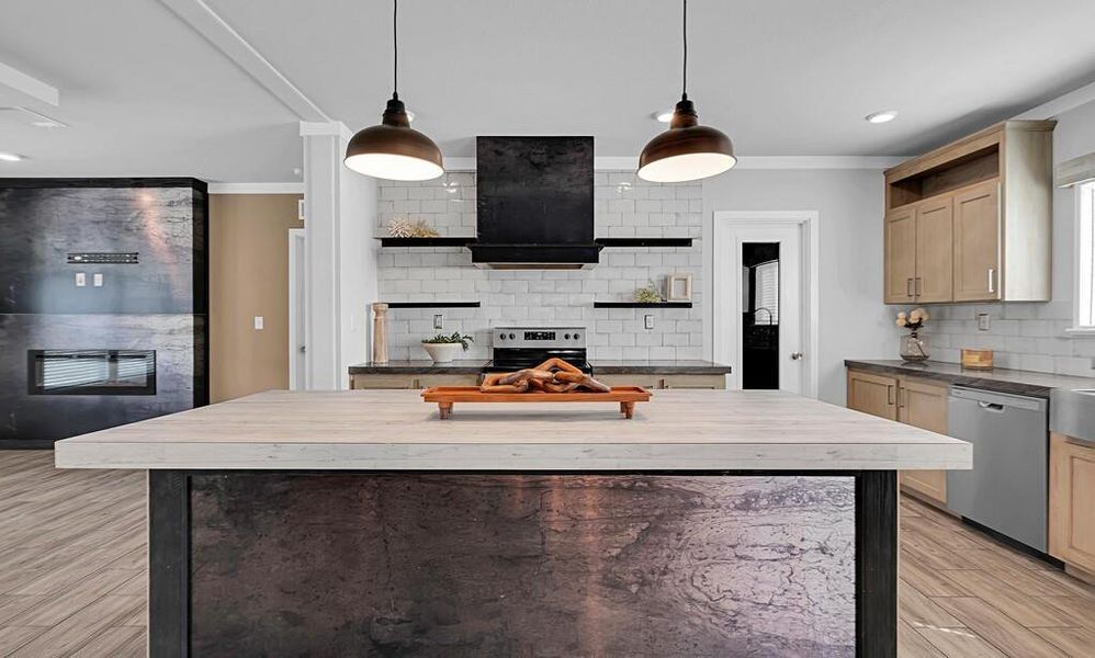 Kitchen featuring open shelves, decorative backsplash, light wood finished floors, a center island, and pendant lighting Kitchen featuring open shelves, decorative backsplash, light wood finished floors, a center island, and pendant lighting