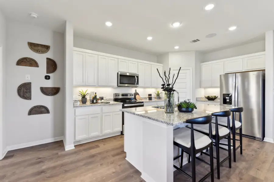 A kitchen with white cabinets. A kitchen with white cabinets.