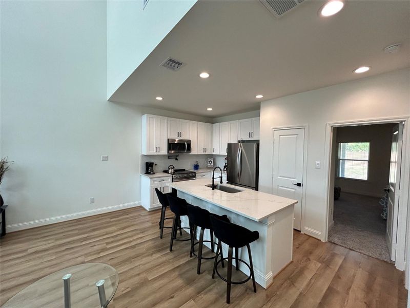 Furnished interior view inside a new home in Spring Branch Crossing, Conroe (Image 9).