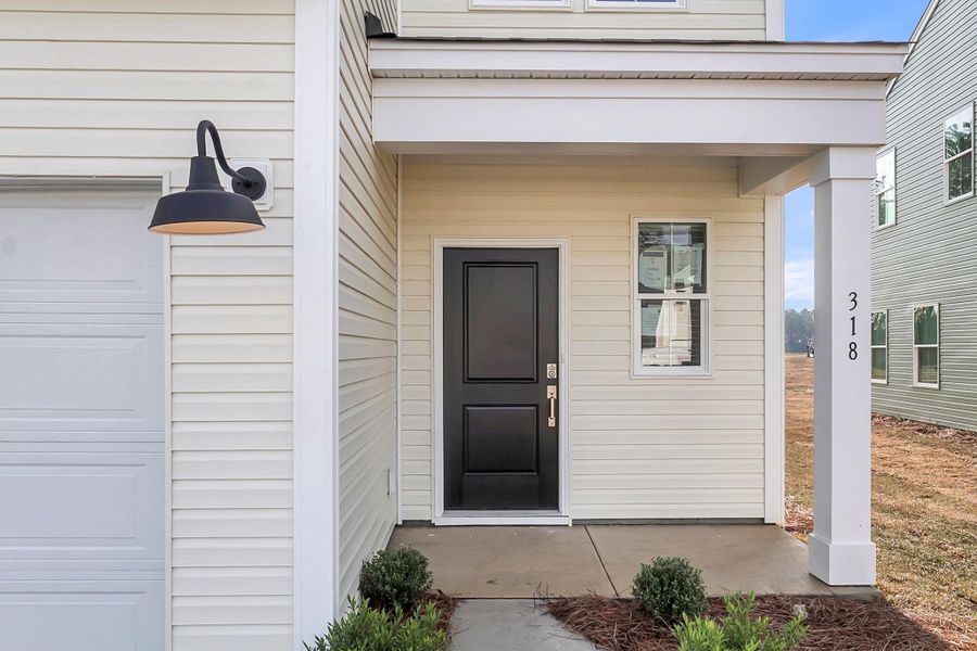 Exterior details and patio area of a home in Wildcat Chase, Summerville (Image 19).