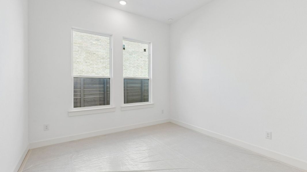Representative unfurnished interior of a home built from the Chapelle III by Normandy Homes in Rainwater Crossing, Celina (Image 11).