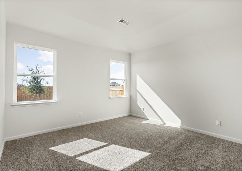 The master bedroom has two large windows.