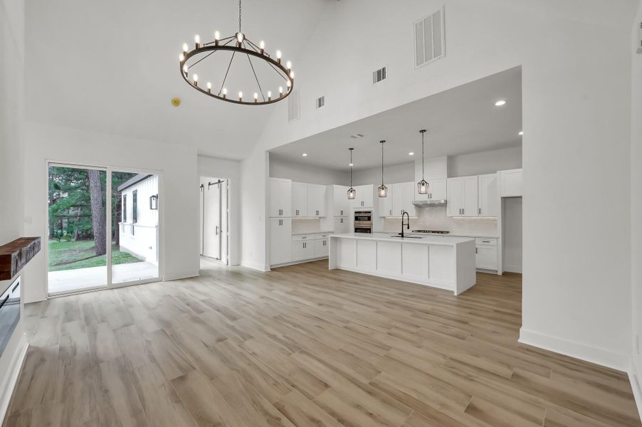Open-concept design connects the living room to the gourmet kitchen, creating the perfect space for entertaining and everyday living.