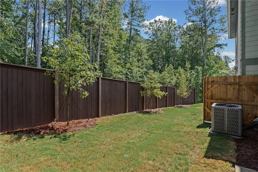 Exterior details and patio area of a home in Ansley Towns, Cumming (Image 4).