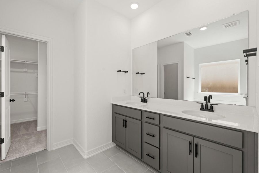 The en-suite bathroom offers a spa-like atmosphere with its elegant design, high end finishes, and tasteful lighting, creating a retreat within your own home. The en-suite bathroom offers a spa-like atmosphere with its elegant design, high end finishes, and tasteful lighting, creating a retreat within your own home.