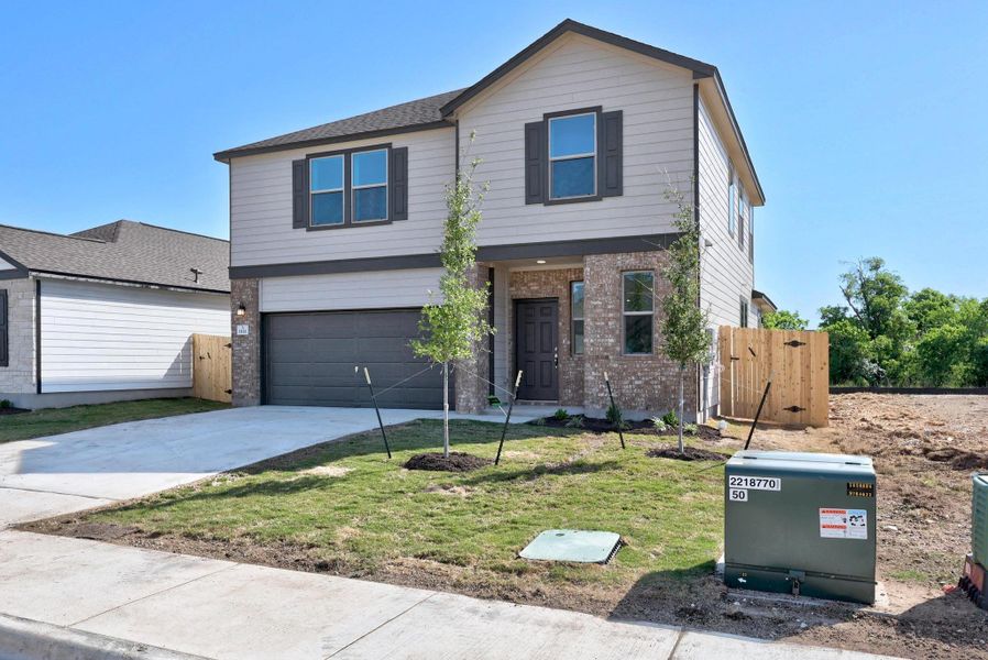 Front exterior of a new home in Overlook Ranch, Georgetown, TX, highlighting curb appeal (Image 1). Front exterior of a new home in Overlook Ranch, Georgetown, TX, highlighting curb appeal (Image 1).