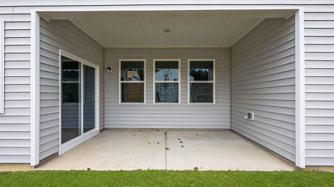 Exterior details and patio area of a home in West New Bern, New Bern (Image 2).