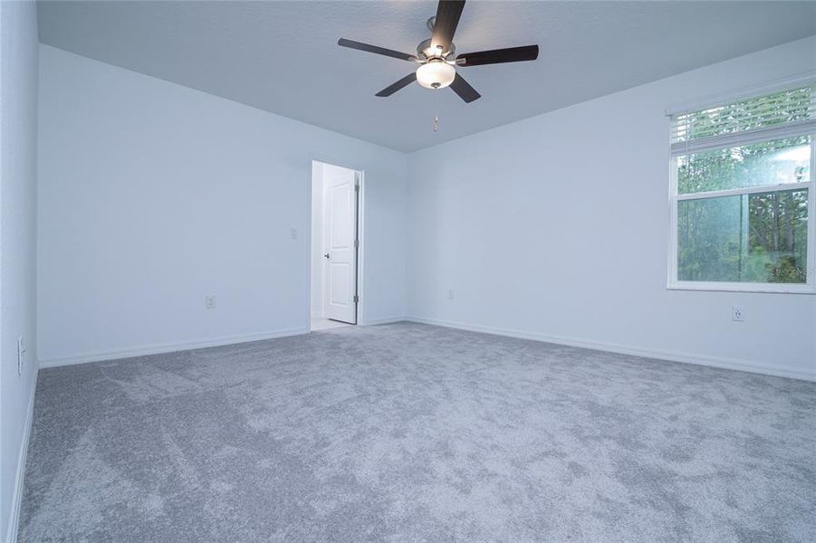 Spacious, unfurnished interior of a new home in Saddle Creek Preserve: The Manors II, Lakeland (Image 46).