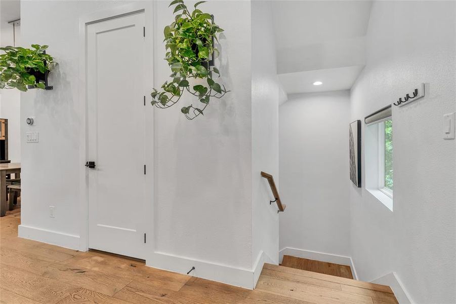 Stairway featuring wood finished floors and recessed lighting Stairway featuring wood finished floors and recessed lighting