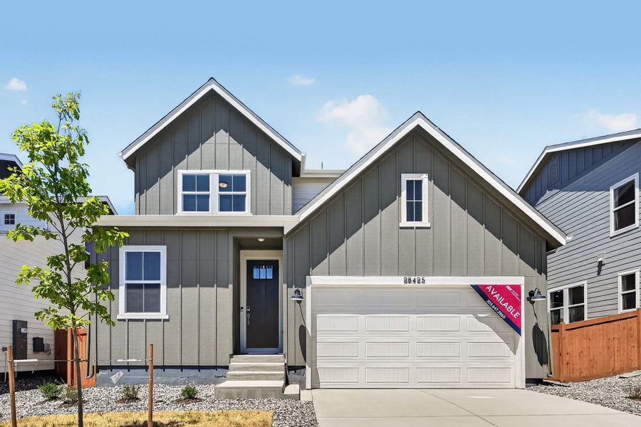 Front exterior of a new home in Sky Ranch, Watkins, CO, highlighting curb appeal (Image 1). Front exterior of a new home in Sky Ranch, Watkins, CO, highlighting curb appeal (Image 1).