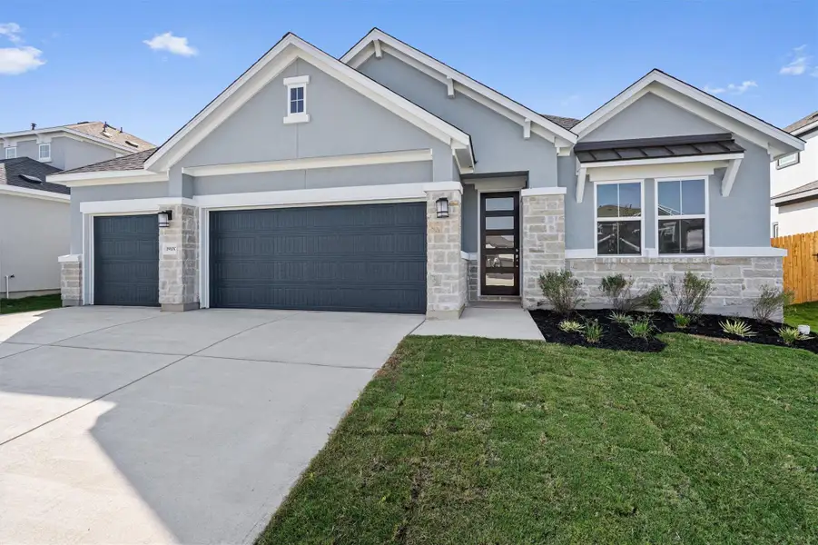 Front exterior of a new home in , Pflugerville, TX, highlighting curb appeal (Image 1).