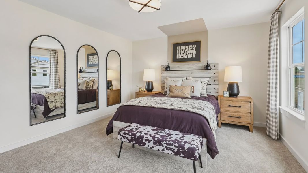 Secondary bedroom with carpet, closet, and window