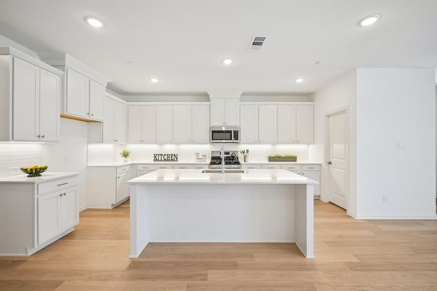 The spacious island is the hub of this fantastic home!