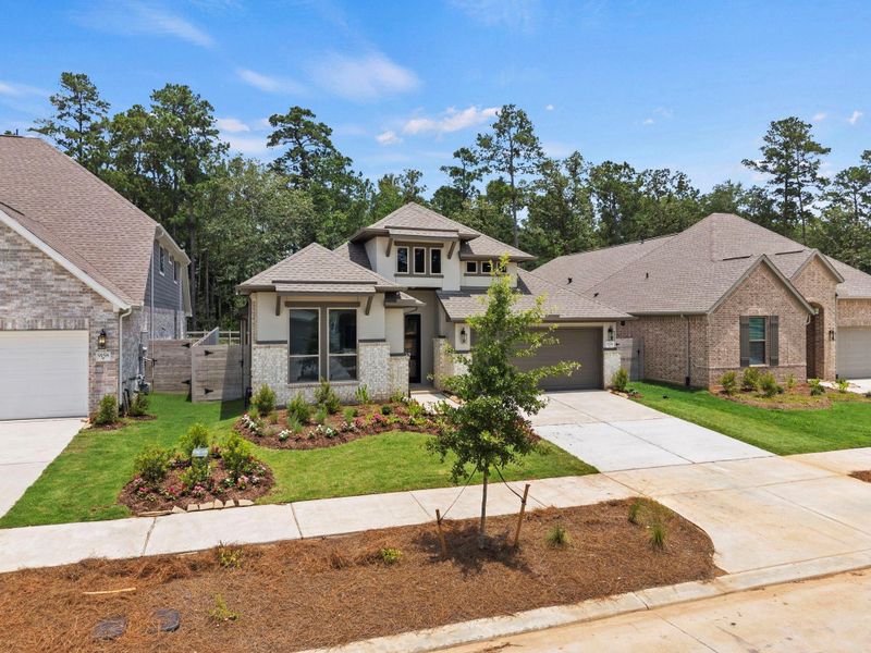 Front exterior of a new home in Two Step Farm, Montgomery, TX, highlighting curb appeal (Image 22). Front exterior of a new home in Two Step Farm, Montgomery, TX, highlighting curb appeal (Image 22).