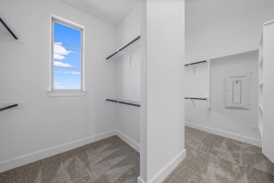 Walk-in closet in Primary Bedroom Walk-in closet in Primary Bedroom