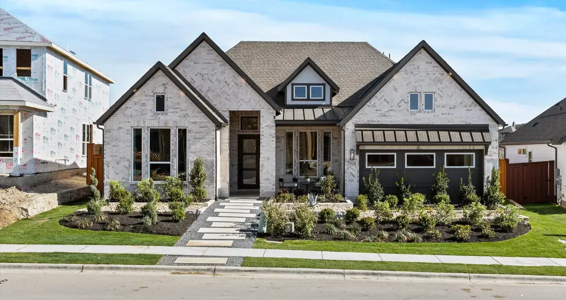 Representative exterior photo of a completed home built from the Malia by Chesmar Homes in 6 Creeks, Kyle, TX (Image 1).