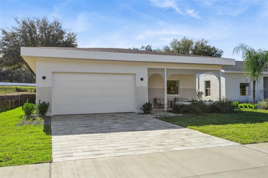Front exterior of a new home in , Lady Lake, FL, highlighting curb appeal (Image 2). Front exterior of a new home in , Lady Lake, FL, highlighting curb appeal (Image 2).