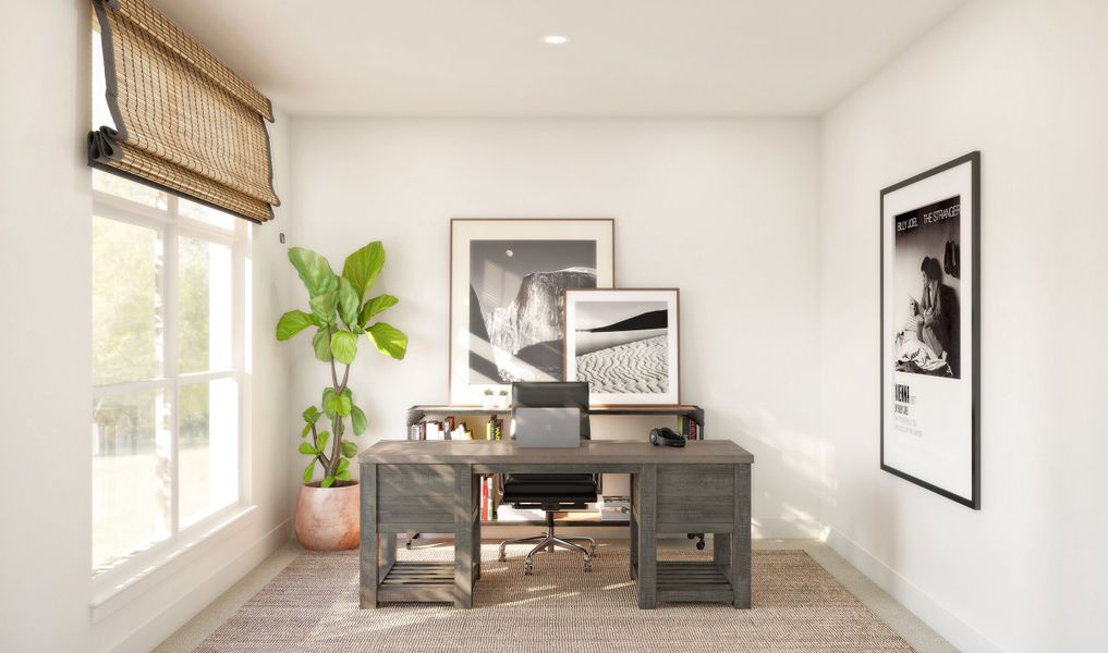 Private home office with double barn doors off foyer