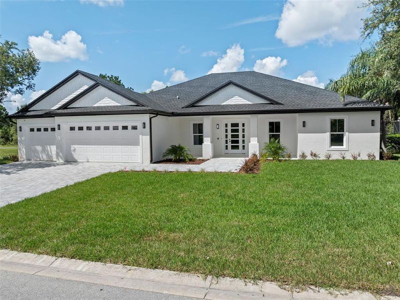 Front exterior of a new home in , Winter Haven, FL, highlighting curb appeal (Image 30).
