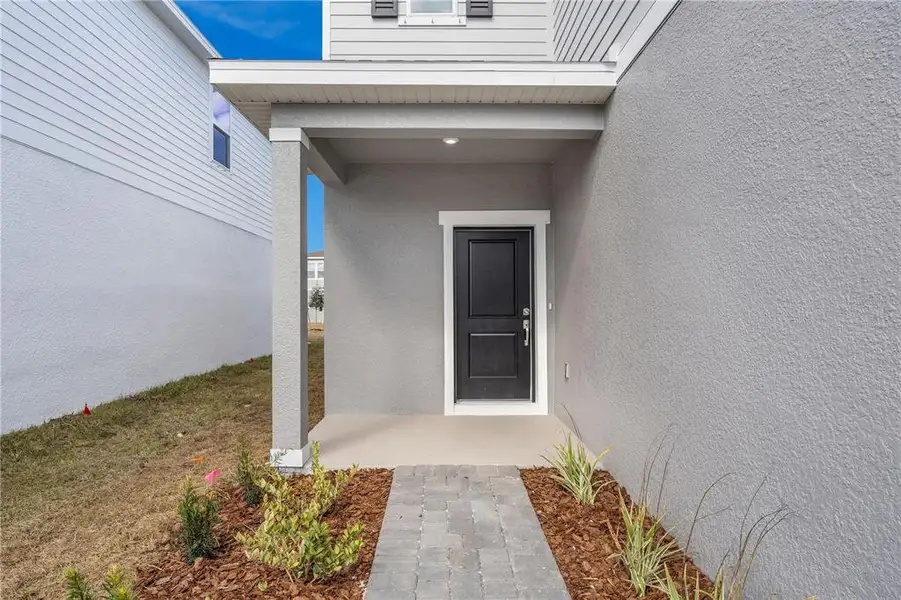 Exterior details and patio area of a home in Oakfield Trails, Parrish (Image 21).