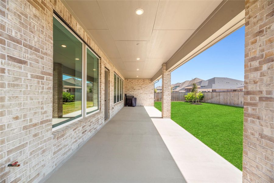 Exterior details and patio area of a home in Bridgeland, Cypress (Image 25).