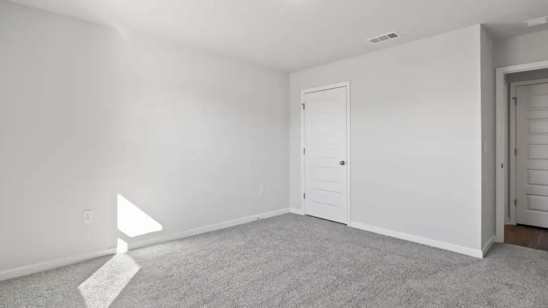 Spacious, unfurnished interior of a new home in Magnolia at the Bluffs Phase 3, Freeport (Image 13).