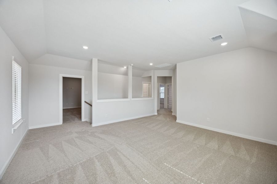 Game room in the Masters home plan by Trophy Signature Homes – REPRESENTATIVE PHOTO