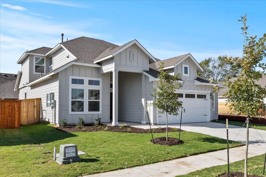 Front exterior of a new home in Trace, San Marcos, TX, highlighting curb appeal (Image 22).