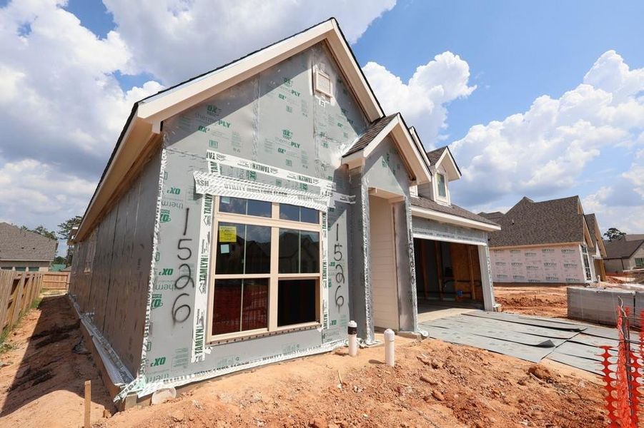 Front exterior of a new home in Escondido 45’ Homesites, Magnolia, TX, highlighting curb appeal (Image 2). Front exterior of a new home in Escondido 45’ Homesites, Magnolia, TX, highlighting curb appeal (Image 2).