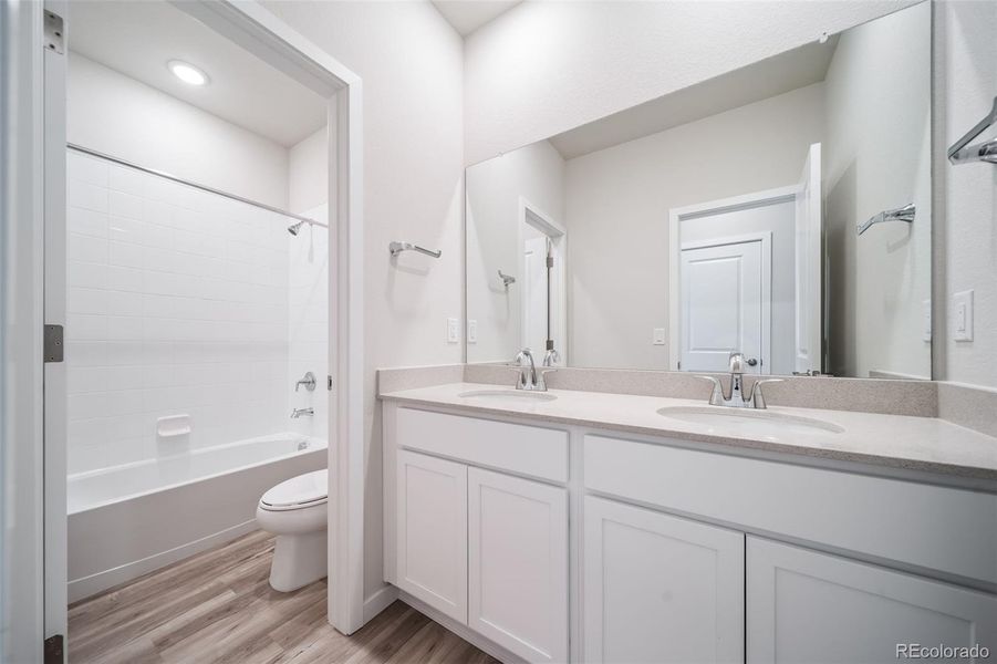 Furnished interior view inside a new home in Floret Collection at Alder Creek, Parker (Image 21).