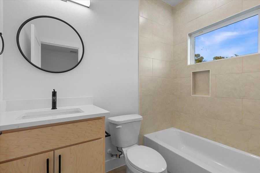 Bathroom featuring vanity and shower / washtub combination Bathroom featuring vanity and shower / washtub combination