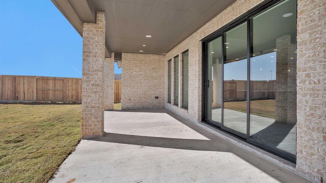 Exterior details and patio area of a home in Jordan Ranch 65', Fulshear (Image 3).