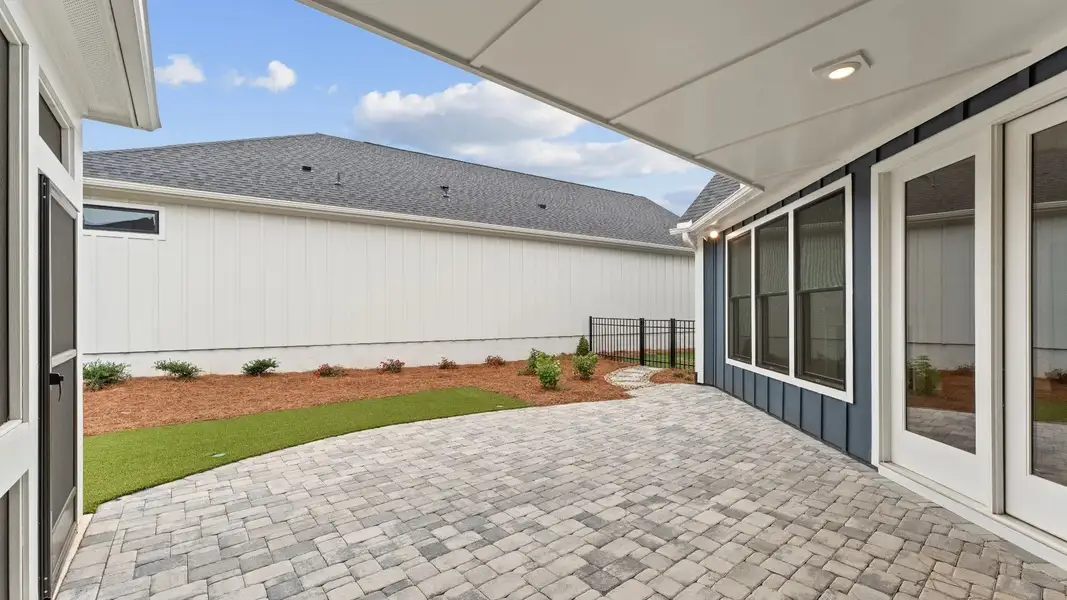 Exterior details and patio area of a home in The Courtyards at Redbud Lane, Canton (Image 3).