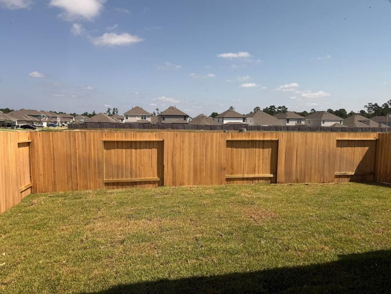 Exterior details and patio area of a home in River's Edge, Conroe (Image 3).