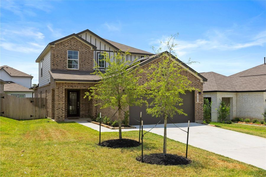 Front exterior of a new home in Lakes at Black Oak, Magnolia, TX, highlighting curb appeal (Image 1).