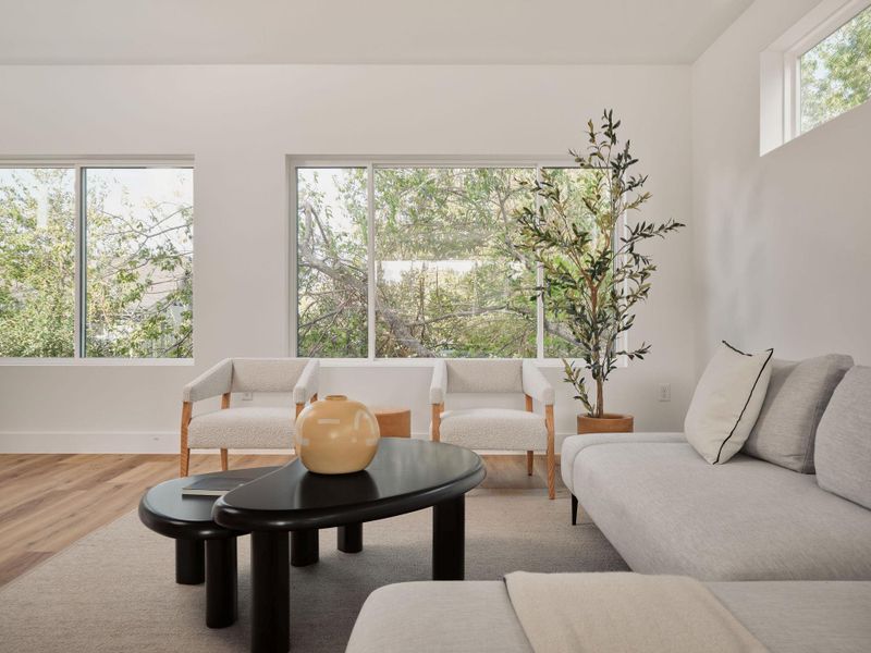 Sitting room with baseboards and wood finished floors