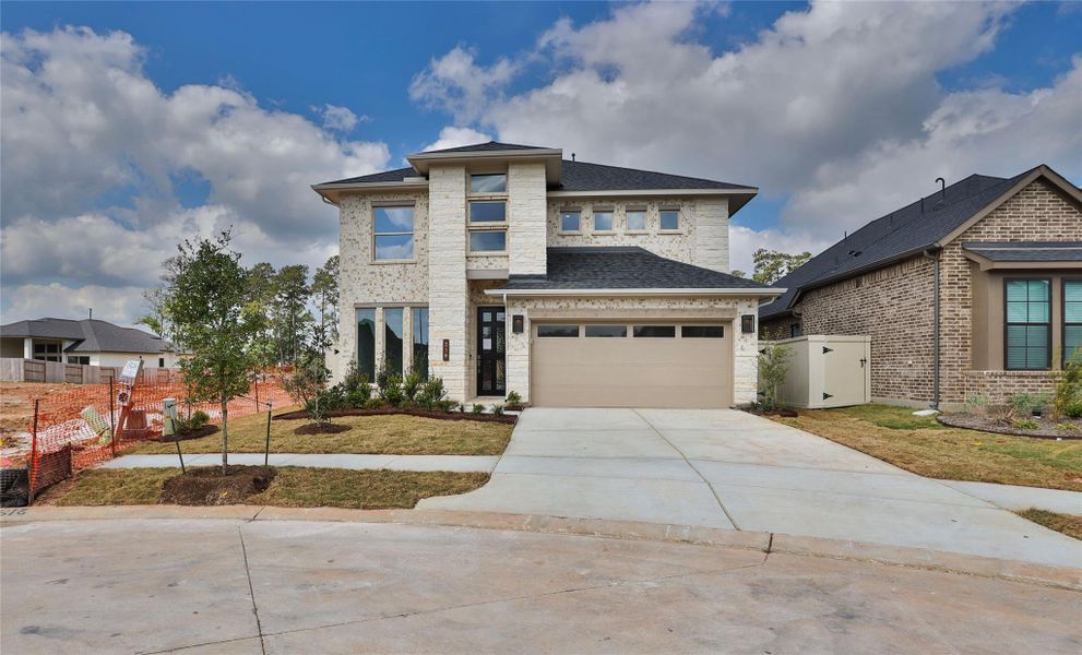 Front exterior of a new home in Audubon, Magnolia, TX, highlighting curb appeal (Image 1). Front exterior of a new home in Audubon, Magnolia, TX, highlighting curb appeal (Image 1).
