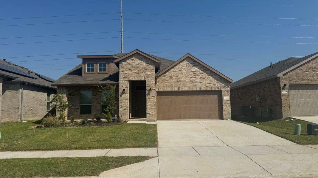 Representative exterior photo of a completed home built from the SANTA FE by D.R. Horton in Bluestem, Rhome, TX (Image 2).