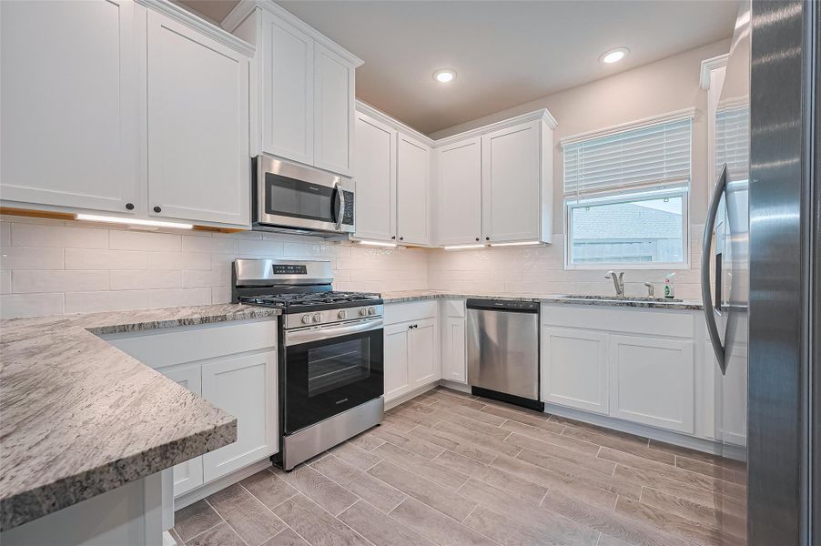 Furnished interior view inside a new home in Sunterra, Katy (Image 8).