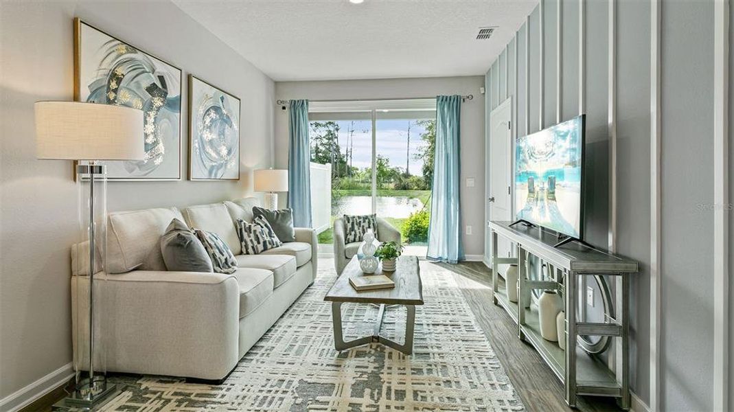 Furnished interior in a model home at Stokes Landing Express in St. Augustine (Image 13).