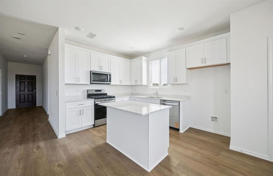 Island overlooking gathering room and dining area Island overlooking gathering room and dining area