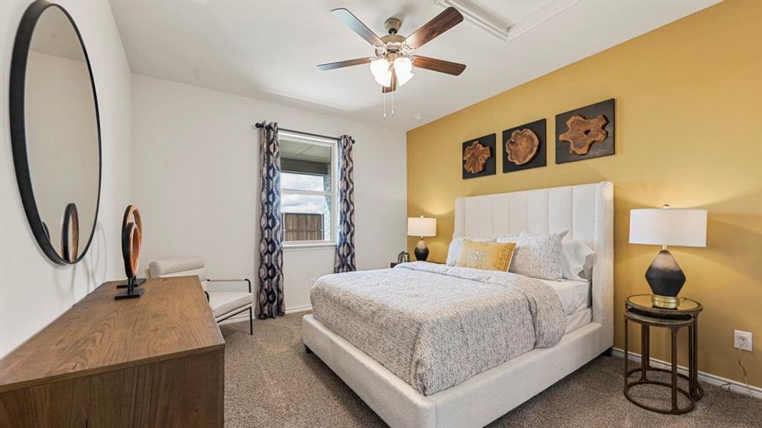 Bedroom with ceiling fan and dark colored carpet Bedroom with ceiling fan and dark colored carpet
