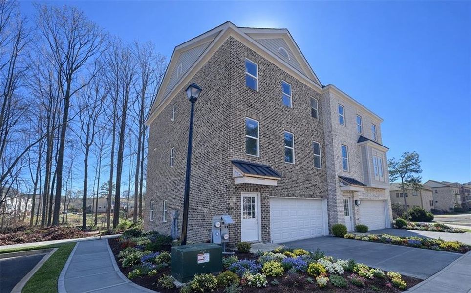 Front exterior of a new home in , Suwanee, GA, highlighting curb appeal (Image 2). Front exterior of a new home in , Suwanee, GA, highlighting curb appeal (Image 2).
