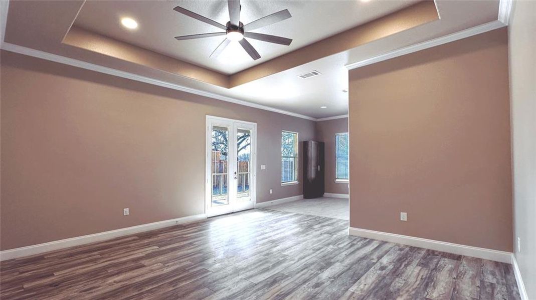 Tray ceiling with flush lighting and elegant finishes and fixtures